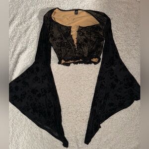 Black and tan corset top with flared sleeves